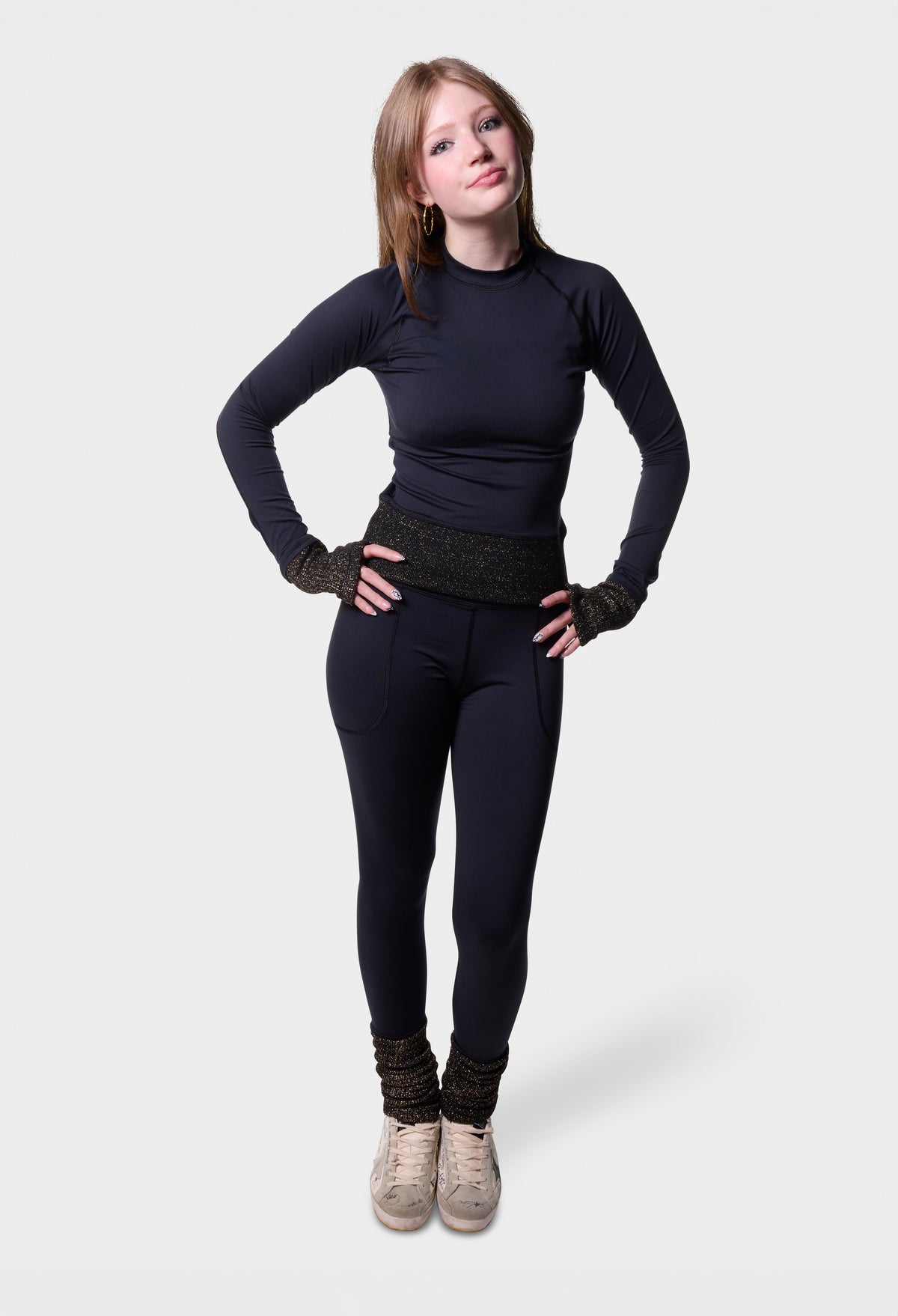 Full-length view of the black Paggo Athena Top with Lurex trim