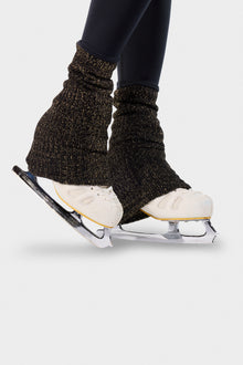 Close-up of the Lurex ankle warmers on the black Paggo Christina Pants