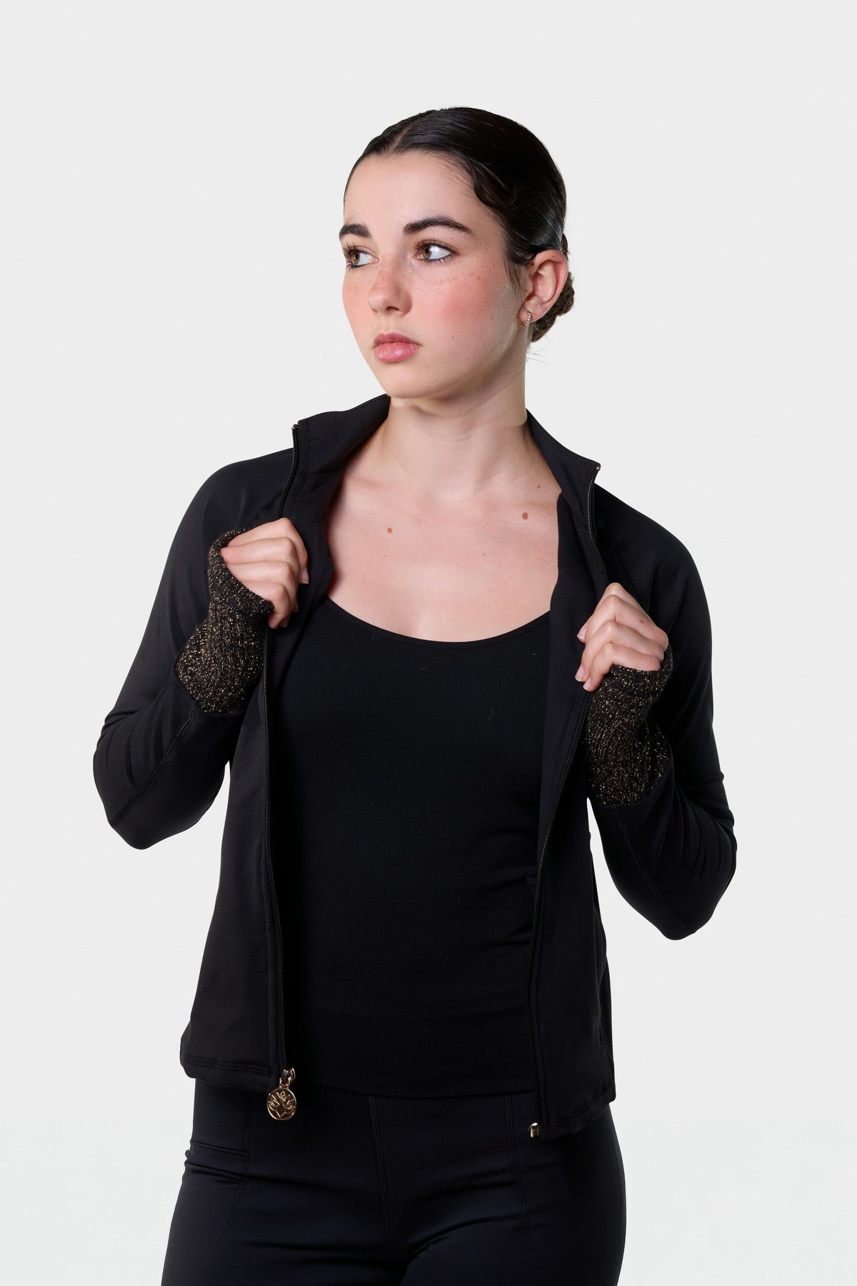 Paggo Elena Long Jacket worn open over a black tank with the Christina Pants, three-quarter view