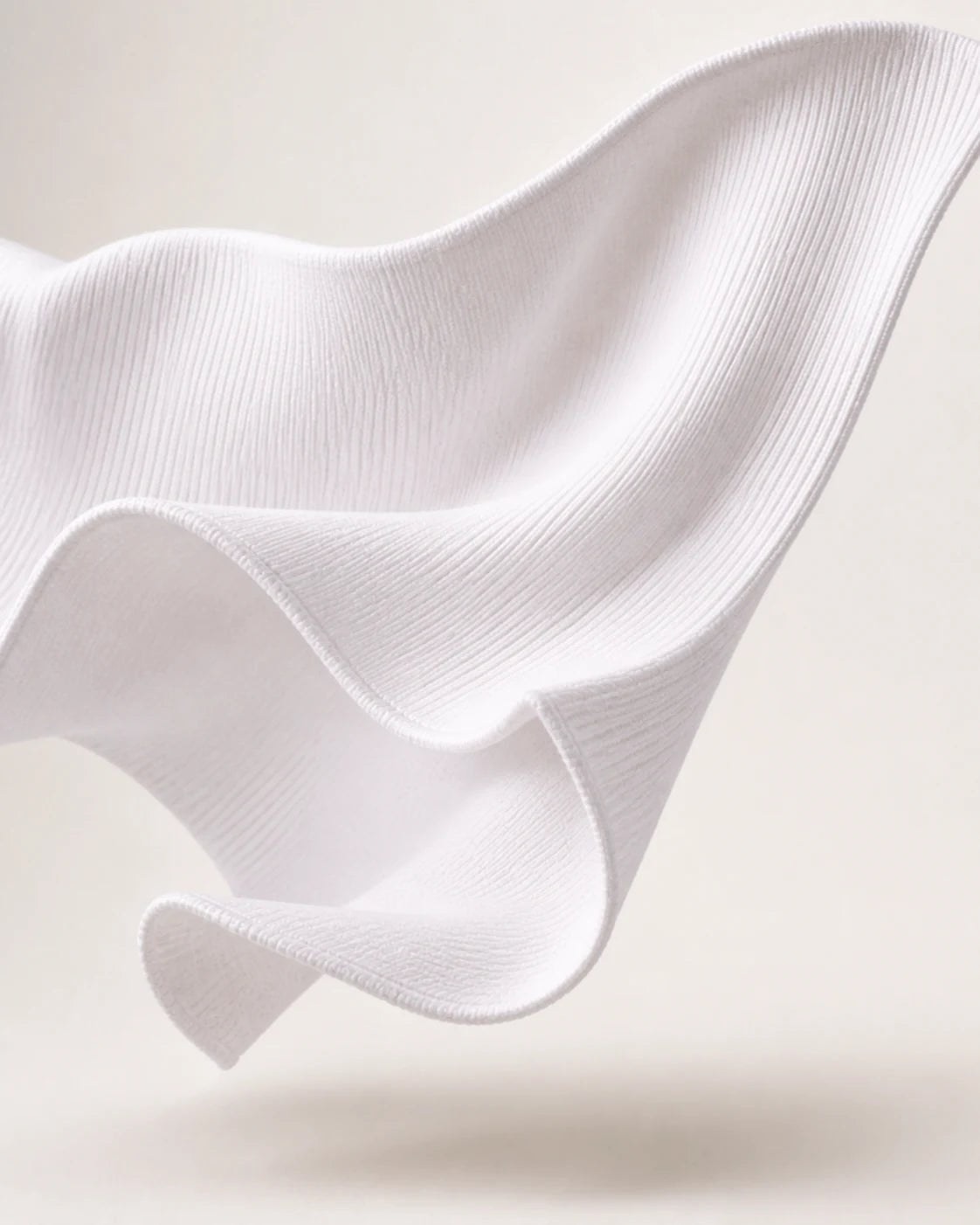 Sculptural study of white main fleece knit used for the Artemis Zip-Up Sweater